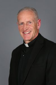 Fr. Hagan sits for a profile photo